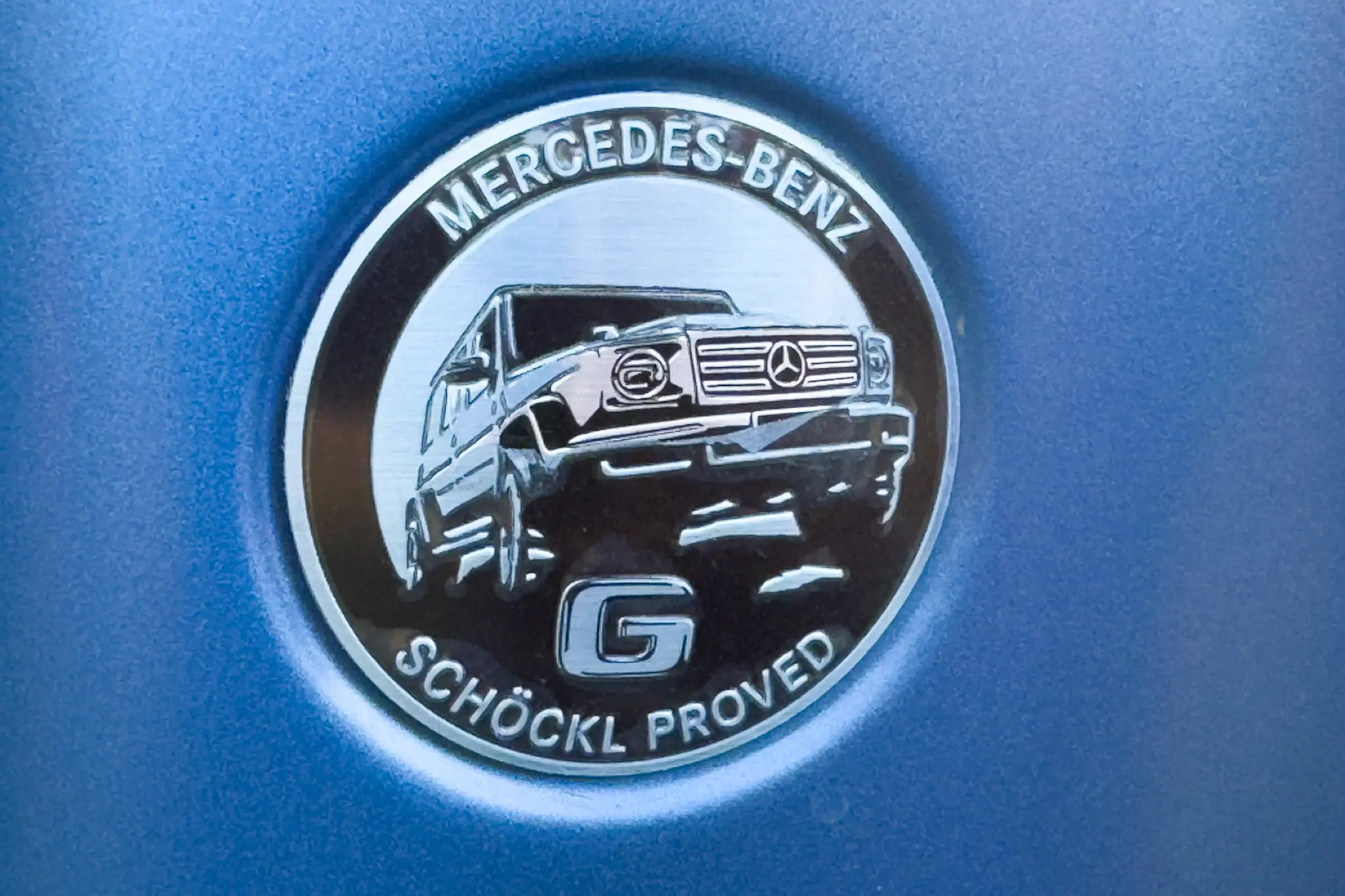 Mercedes-Benz G580 - logótipo de Schöckl